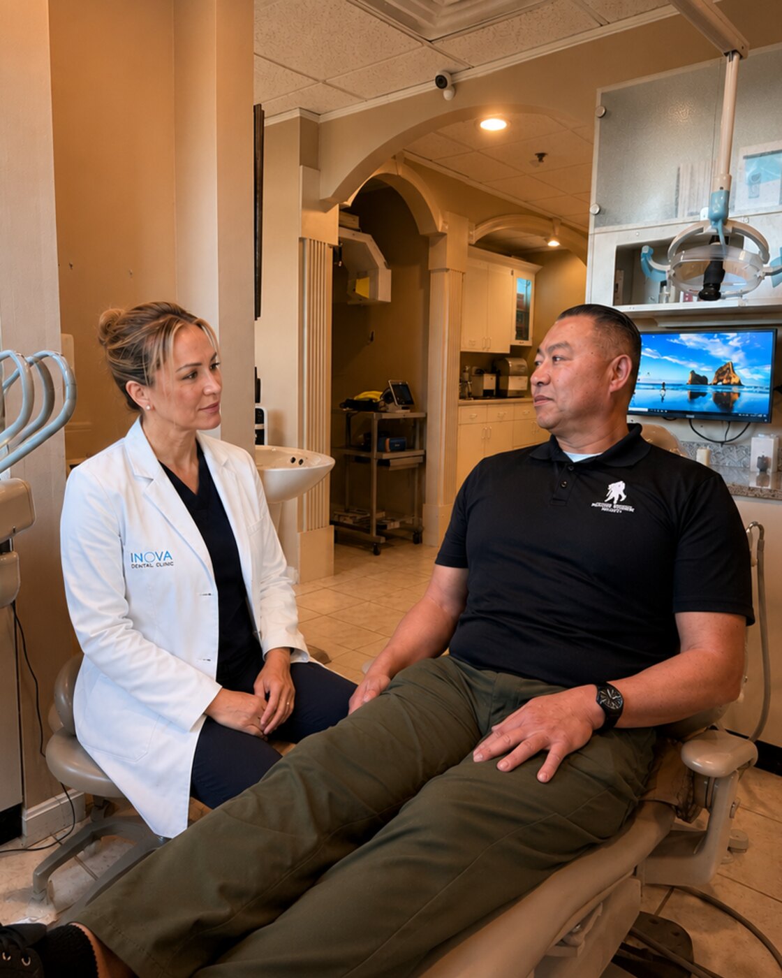 Dr. Mahnaz Jafari caring for a patient at Inova Dental Clinic in Sterling, VA